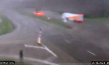 Traffic camera video shows an apparent tornado topple a semi-truck along an Iowa highway.