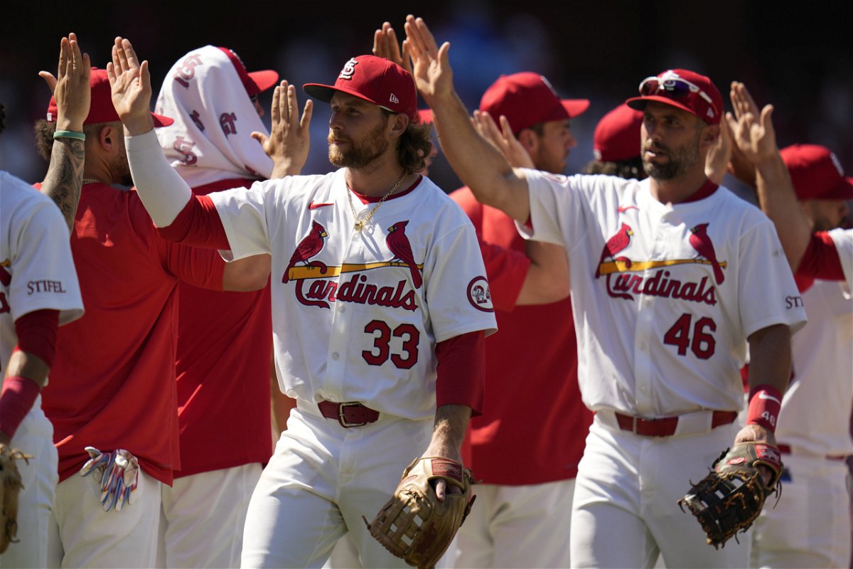 St. Louis Cardinals' Brendan Donovan (33) and Paul Goldschmidt (46) celebrate with teammates following a 4-3 victory over the Pittsburgh Pirates in a baseball game Thursday, June 13, 2024, in St. Louis. (AP Photo/Jeff Roberson)