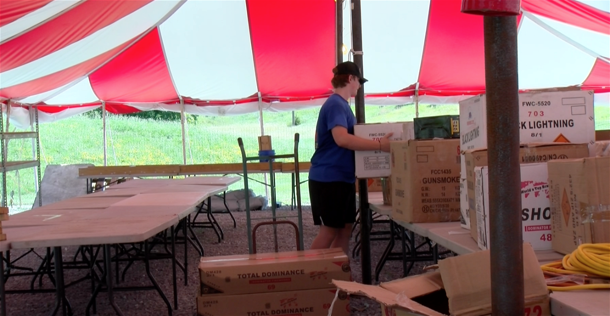 An employee at Firework City just outside of Columbia prepares for opening day of sales on Thursday, June 20, 2024. 
