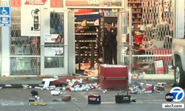 Police say an AutoZone in South Los Angeles was looted by a large crowd after a street takeover at Century Boulevard and Hoover Street.