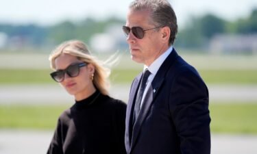 Hunter Biden walks with his wife