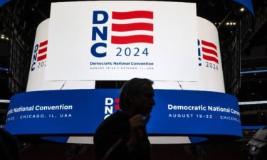 The logo for the Democratic National Convention is displayed on the scoreboard at the United Center in Chicago during a media walkthrough on January 18