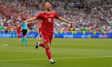 Christian Eriksen celebrates after scoring Denmark's opening goal against Slovenia.
