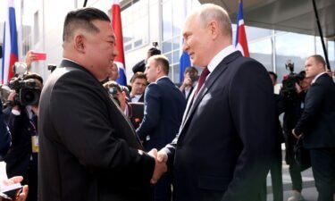 Russian President Vladimir Putin greets North Korean leader Kim Jong Un ahead of their tour of the Vostochny Cosmodrome space launch center in Russia's Amur region in September 2023.