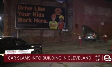 A car crashed into a building on Cleveland's east side right under a billboard that reads