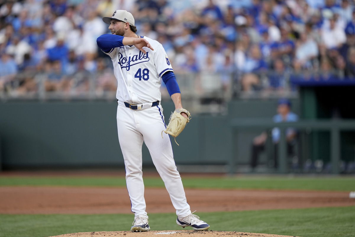 Kansas City Royals starting pitcher Alec Marsh wipes away sweat during the first inning of a baseball game against the Tampa Bay Rays Thursday, July 4, 2024, in Kansas City, Mo. (AP Photo/Charlie Riedel)