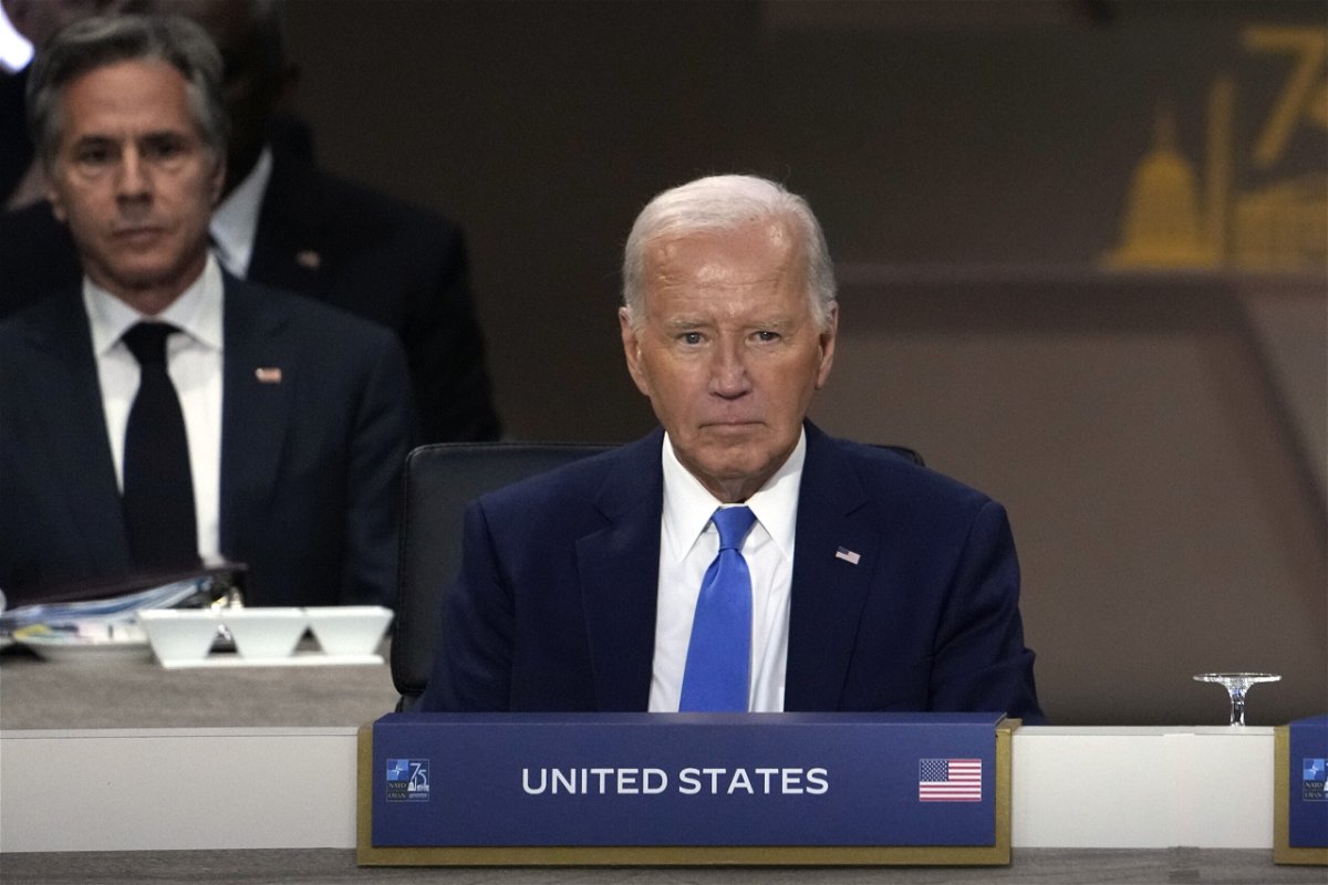 President Joe Biden sits as Secretary of State Antony Blinken, left, looks on during Working Session III of the NATO Summit in Washington, Thursday, July 11, 2024. 