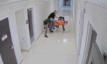 Deputies attempting to get Fisk to knees so he could be transported by wheelchair to the next unit