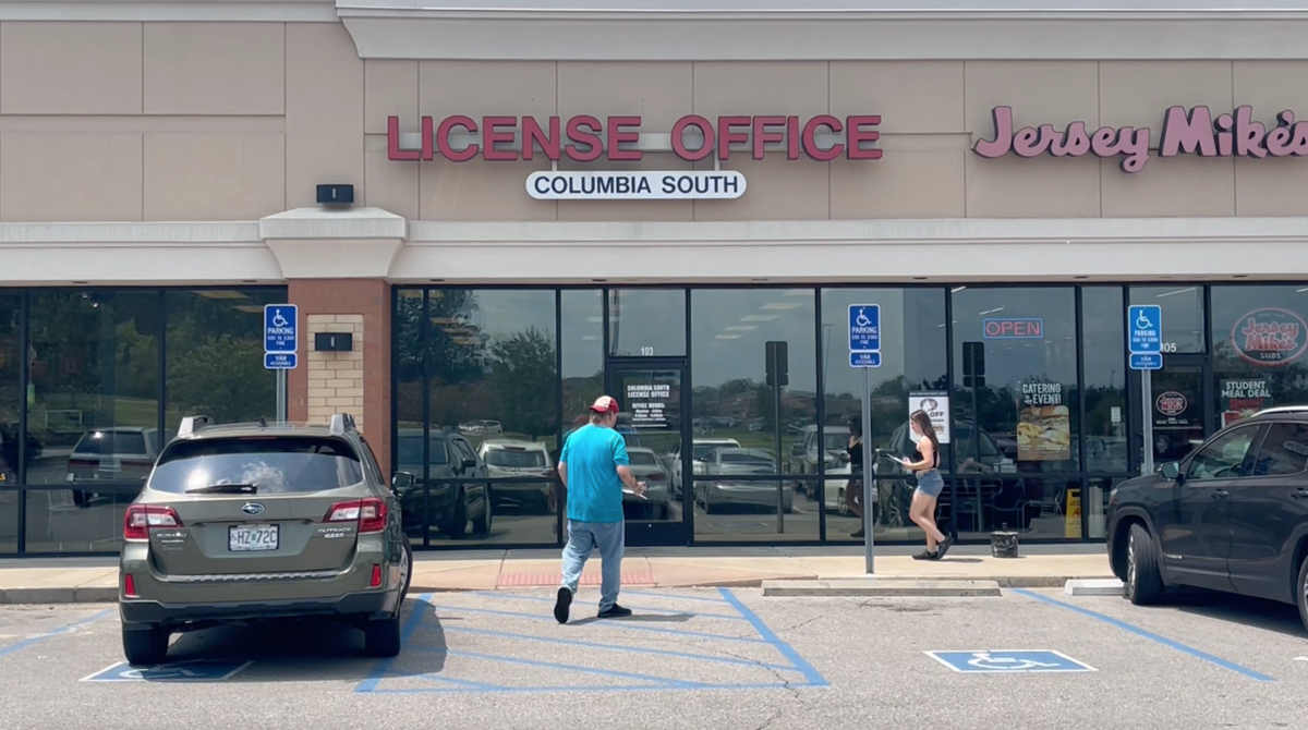 Two people walk into the License Office in South Columbia on Thursday, July 25, 2024.