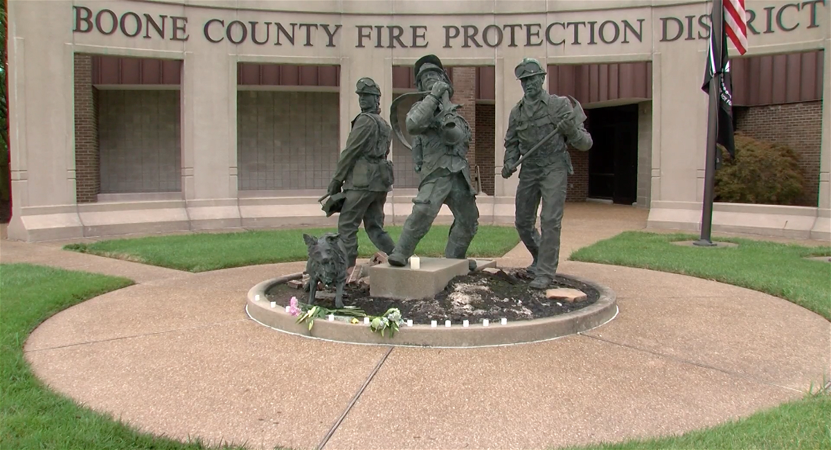 Candles are placed outside of the Boone County Fire Protection District headquarters on Monday in honor of Matt Tobben