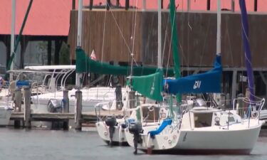 A teenager jumped onto a runaway boat that was going in circles after the captain fell overboard.