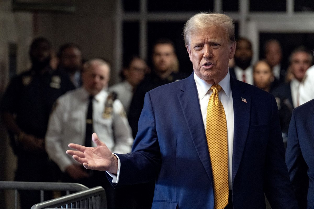 Former US President Donald Trump speaks to the press as he arrives to attend his trial for allegedly covering up hush money payments linked to extramarital affairs, at Manhattan Criminal Court in New York City, on May 14.
