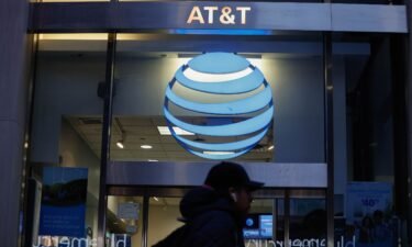 A person walks past an AT&T Store in Midtown Manhattan on January 23