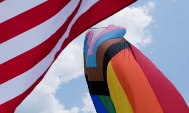 The US and rainbow flags during an all-ages LGBTQ Pride event in Franklin