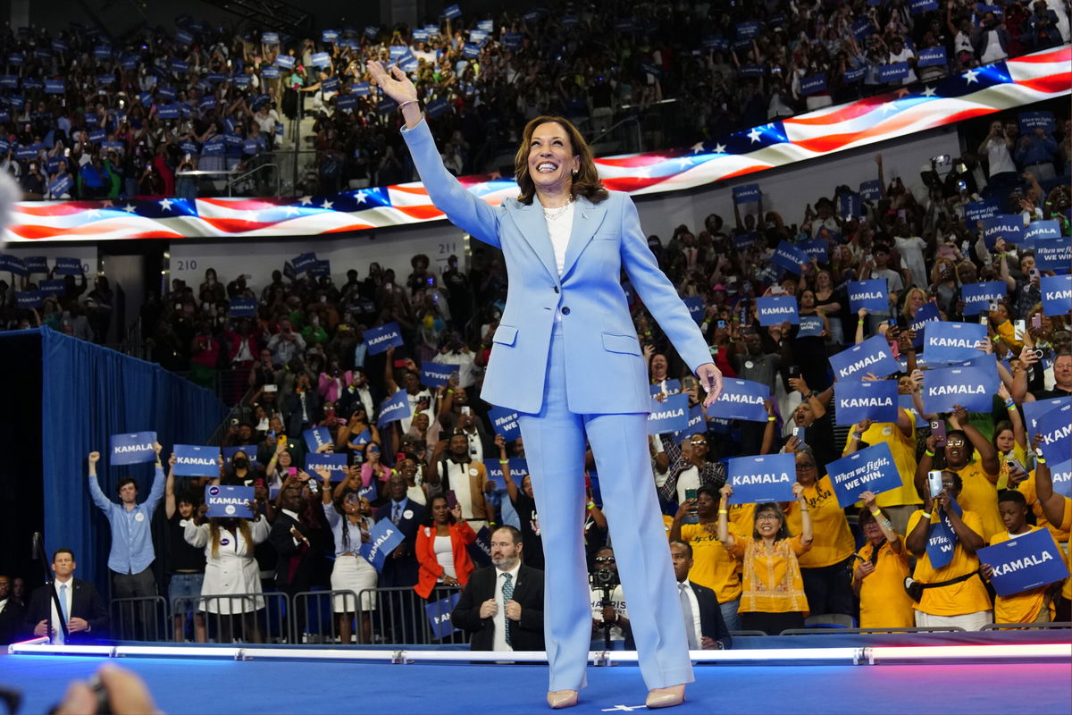 FILE - Vice President Kamala Harris waves during a campaign rally, July 30, 2024, in Atlanta.