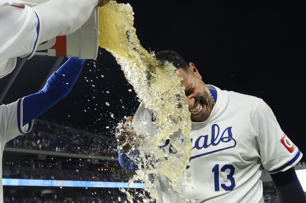 Kansas City Royals' Salvador Perez is doused after his team defeated the St. Louis Cardinals in a baseball game, Saturday, Aug. 10, 2024, in Kansas City, Mo. 