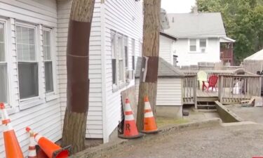 Police in Boston are looking for a person who was seen peering into windows of a multi-family home near Boston College.