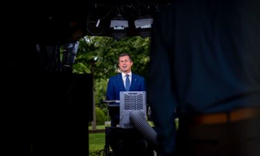 Transportation Secretary Pete Buttigieg speaks during an interview on the North Lawn of the White House in Washington