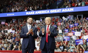 Former President Donald Trump stands onstage with his running mate