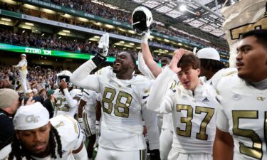 Georgia Tech Yellow Jackets players celebrate after upsetting the No. 10 Florida State Seminoles at Aviva Stadium in Dublin