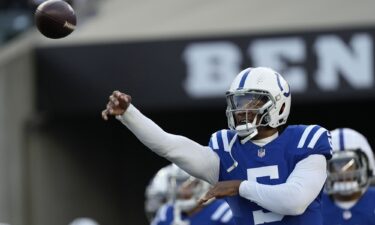 Richardson throws the ball during warmups.