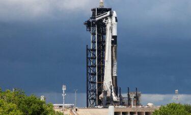 A SpaceX Falcon 9 rocket intended for the Polaris Dawn mission sits on a launchpad at Kennedy Space Center in Cape Canaveral