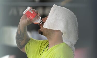 A construction worker hydrates at the Shedd Aquarium Tuesday