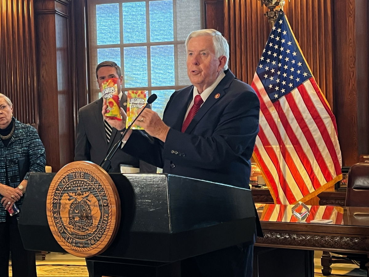 Gov. Mike Parson compares regular candy to unregulated cannabis edibles when announcing his executive order banning sales of unregulated cannabis products on Thursday, Aug. 1, 2024, in the Governor's Office.