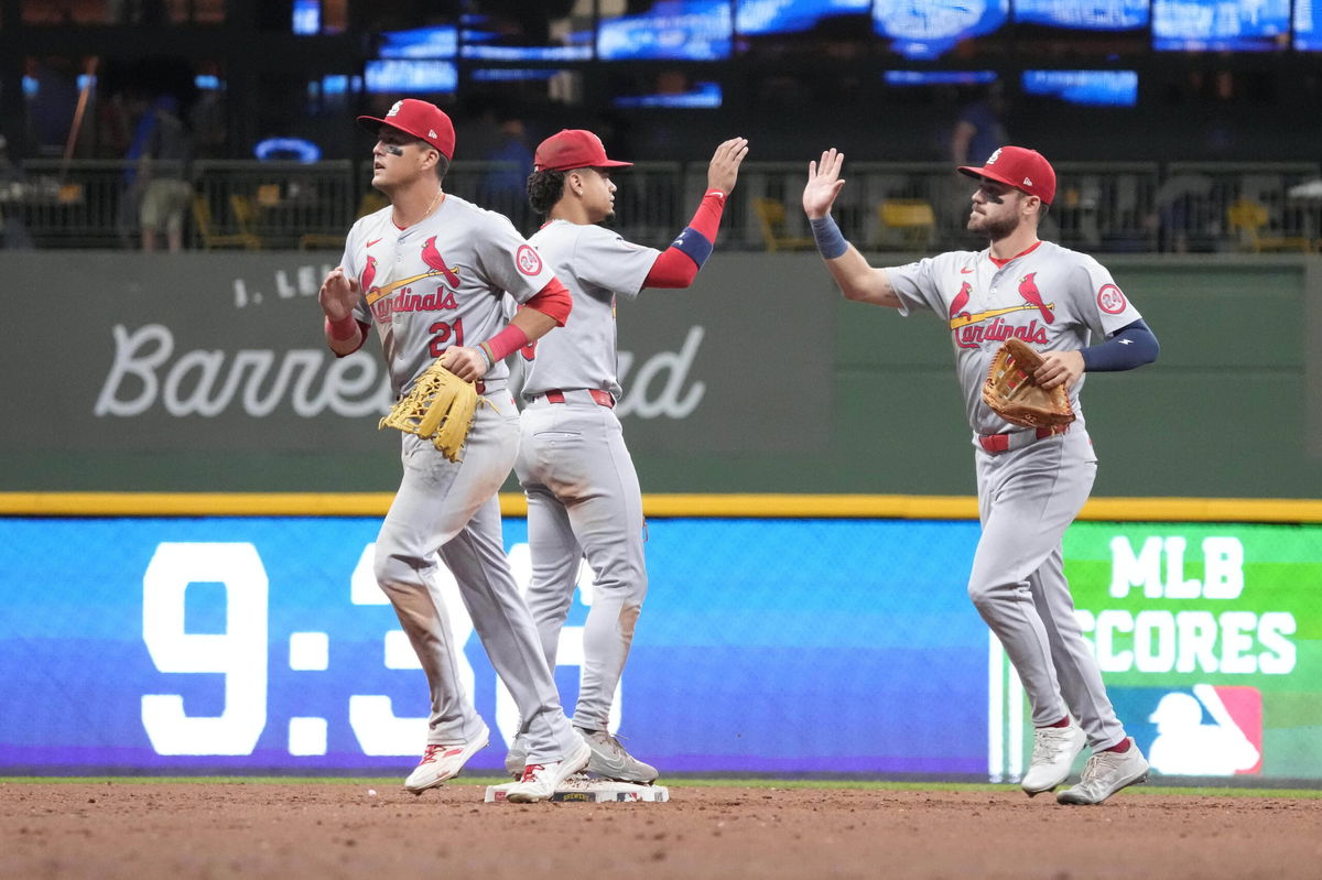 St. Louis Cardinals outfielder Lars Nootbaar (21), shortstop Masyn Winn and outfielder Michael Siani celebrate defeating the Milwaukee Brewers on Wednesday, Sept. 4, 2024, in Milwaukee. (AP Photo/Kayla Wolf)