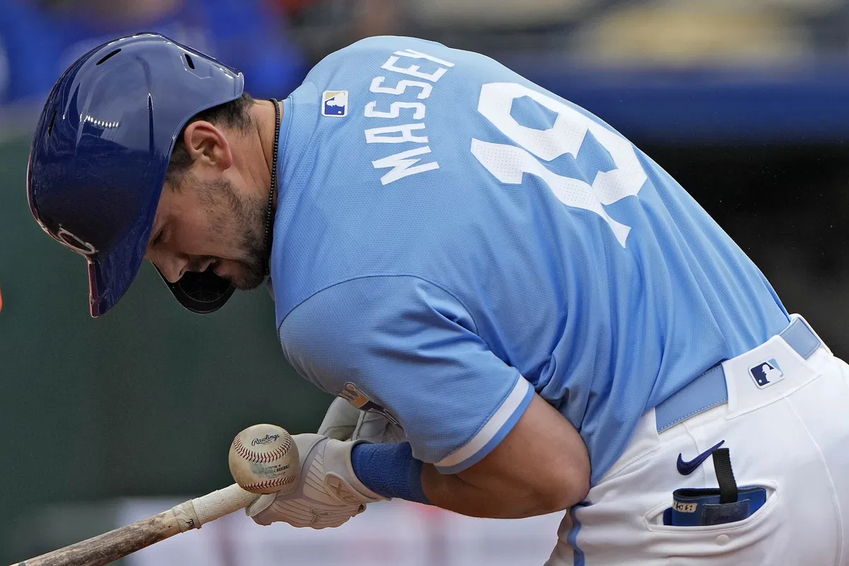 Kansas City Royals' Michael Massey is hit by a pitch thrown by San Francisco Giants relief pitcher Tyler Rogers during the eighth inning of a baseball game Sunday, Sept. 22, 2024, in Kansas City, Mo. (AP Photo/Charlie Riedel)