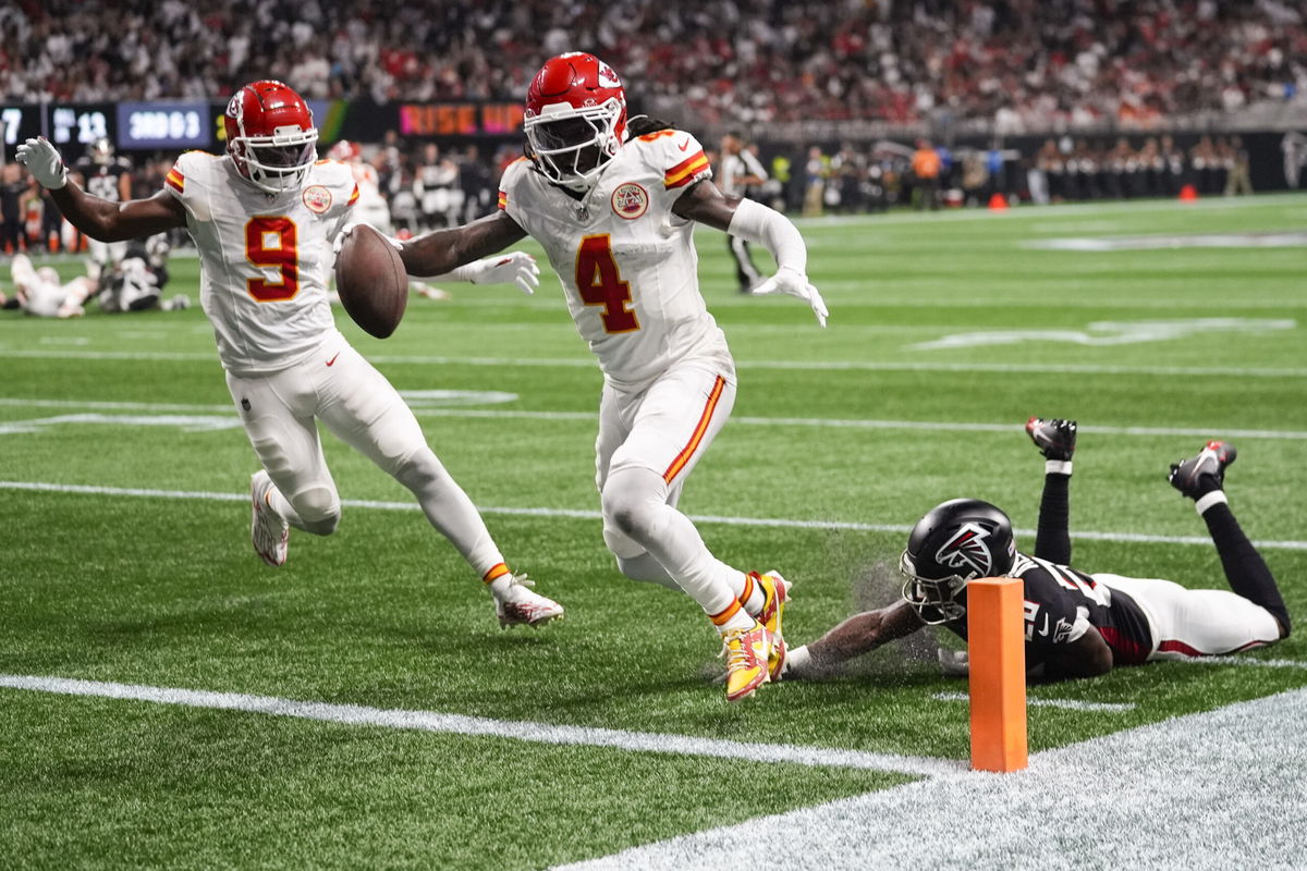 Kansas City Chiefs wide receiver Rashee Rice (4) scores a touchdown against Atlanta Falcons cornerback Dee Alford (20) during the first half of an NFL football game, Sunday, Sept. 22, 2024, in Atlanta. 