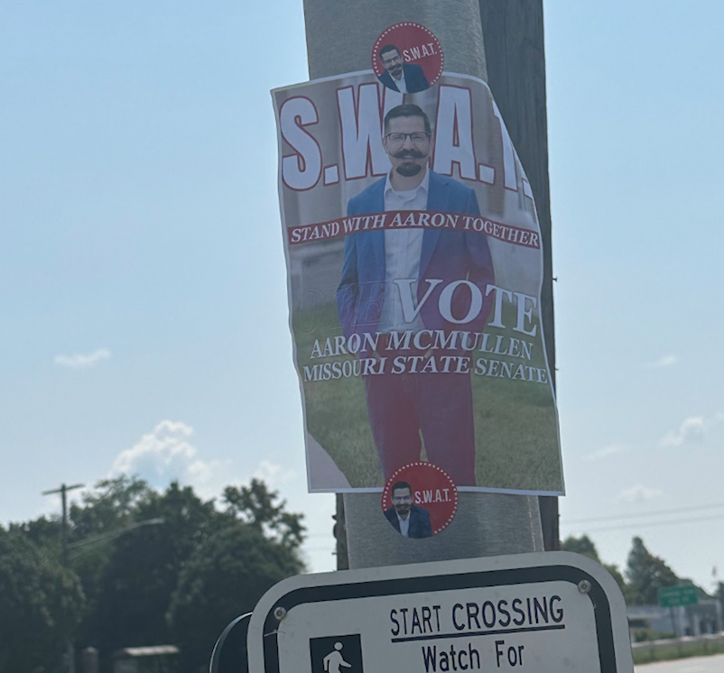 A campaign sign for Aaron McMullen on a street post in Long Island, New York.