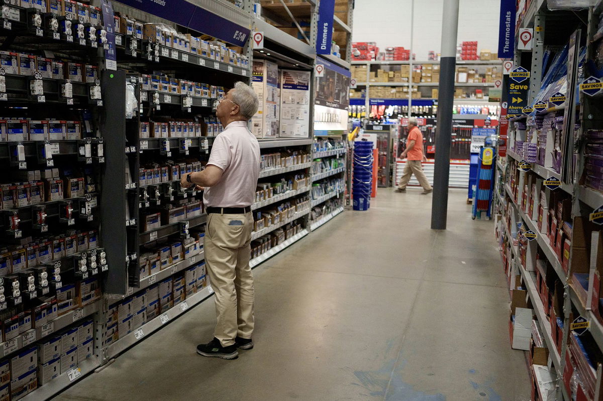 A customer shops in a Lowe's home improvement store in Los Angeles on August 20.
