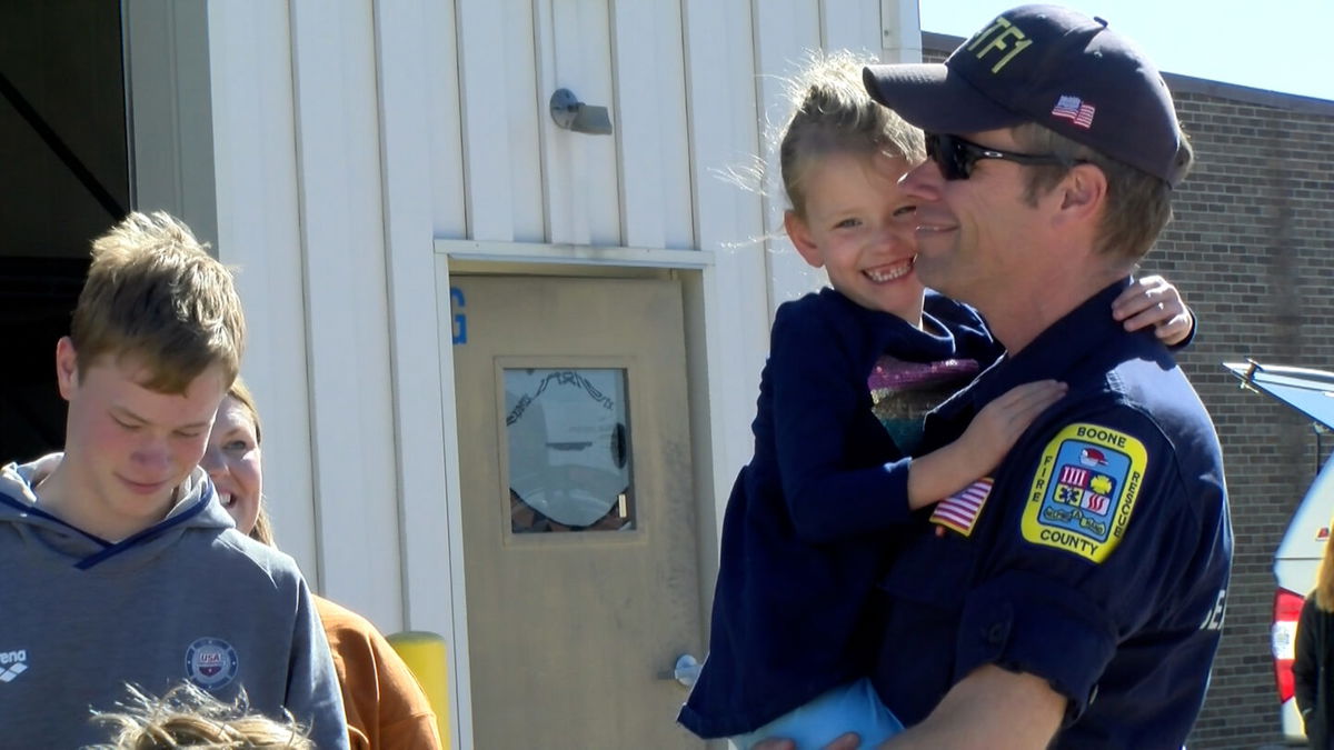 Missouri Task Force 1 member Dan Haid hugs his 4-year old daughter Clara on Friday after returning from an over 3-week deployment in North Carolina on Oct. 18, 2024.