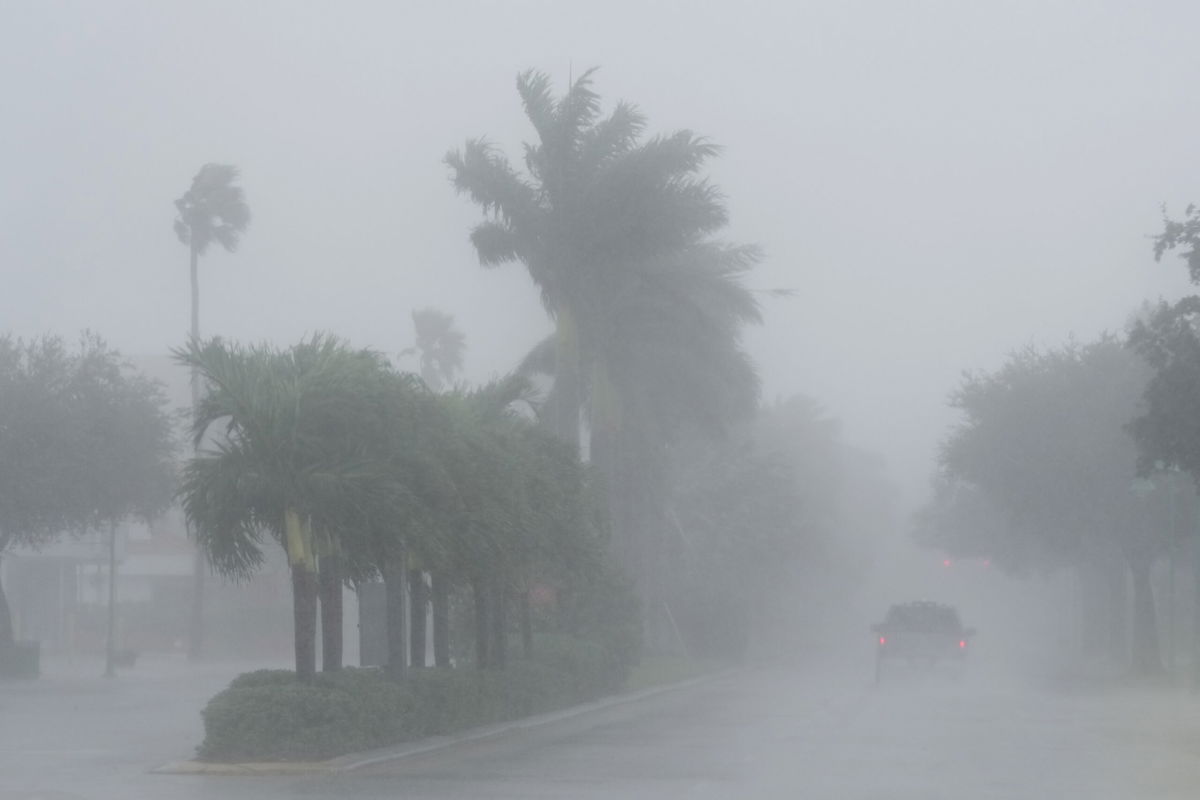 A Lee County Sheriff's officer patrols the streets of Cape Coral, Fla., as heavy rain falls ahead of Hurricane Milton, Wednesday, Oct. 9, 2024.