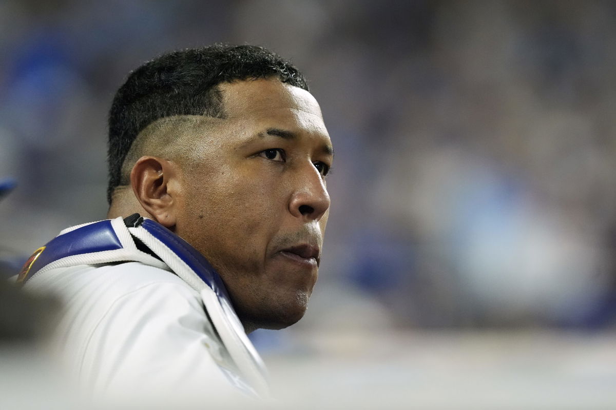 Kansas City Royals' Salvador Perez watches from the dugout during the fifth inning in Game 4 of an American League Division baseball playoff series against the New York Yankees Thursday, Oct. 10, 2024, in Kansas City, Mo.