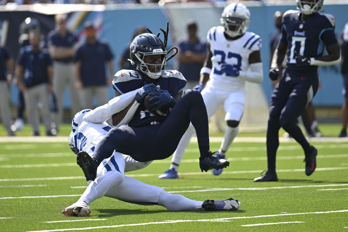 Tennessee Titans' DeAndre Hopkins (10) makes a catch against Indianapolis Colts' Jaylon Jones (40) during the first half of an NFL football game, Sunday, Oct. 13, 2024, in Nashville, Tenn.