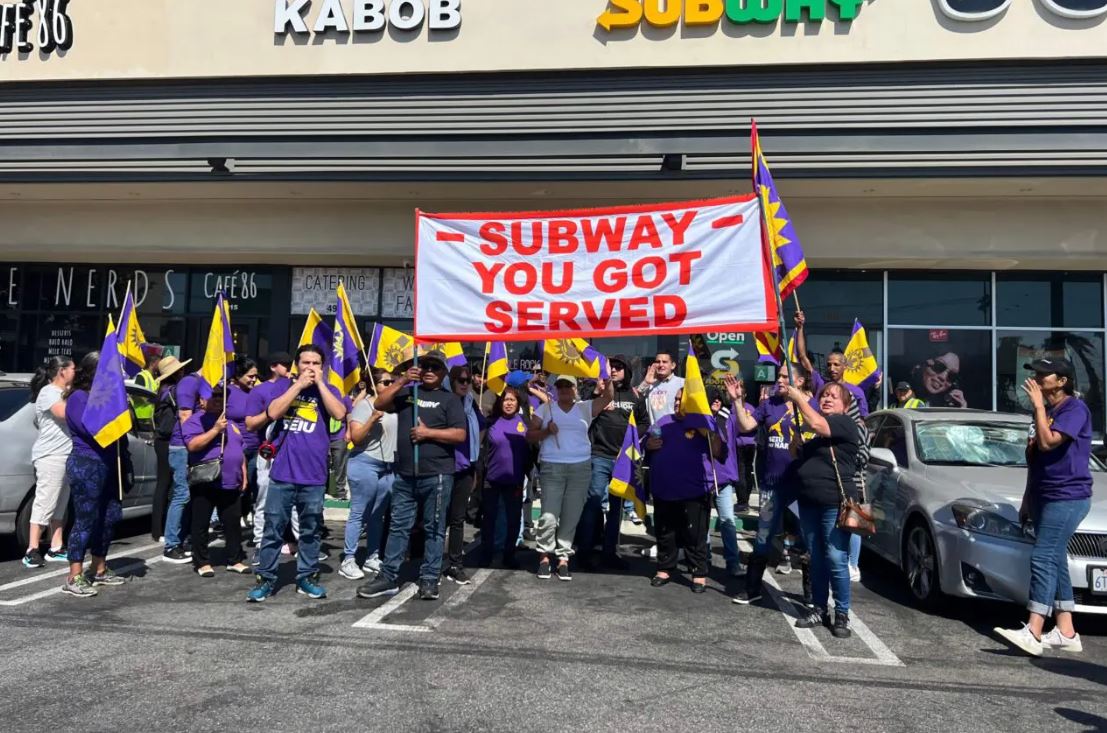 <i>L.A. Post Staff via CNN Newsource</i><br/>Los Angeles fast-food cooks and cashiers rallied Tuesday at a Subway in Eagle Rock to show support for Eva Rodriguez