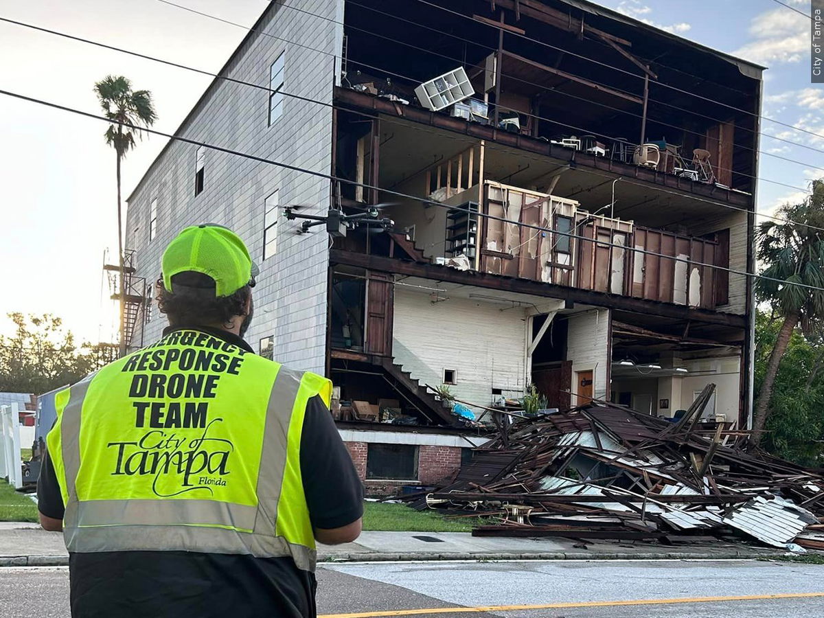 Workers assess damage in Tampa, Florida, after Hurricane Milton.