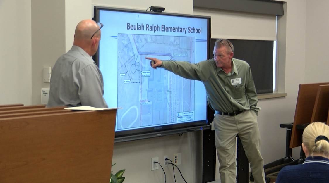 City staff pitch a plan to build a new water tower near two schools in Columbia's school district.