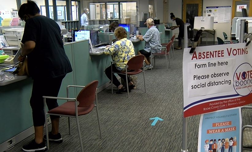 FILE -- Voters cast absentee ballots in the Boone County Clerk's Office before the November 2020 election.