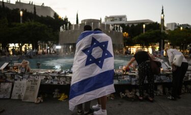 People look at a memorial for victims of the cross-border attack by Hamas militants on the one-year anniversary in Tel Aviv