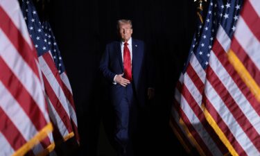 Former President Donald Trump arrives at a campaign rally on October 18 in Detroit