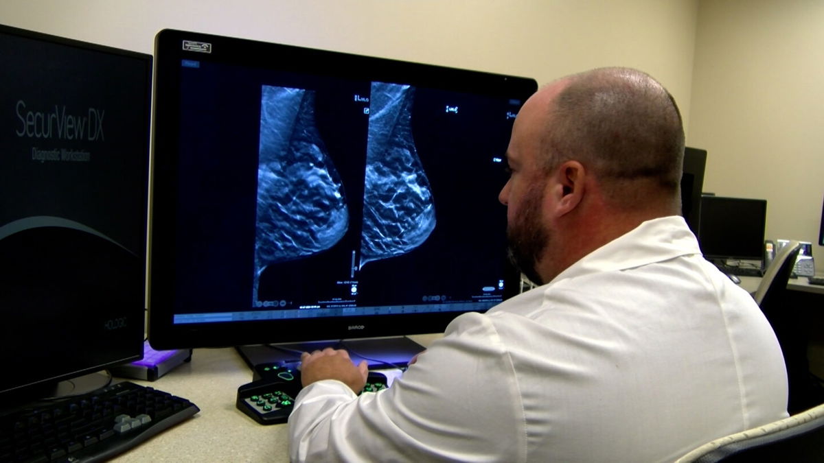 Dr. Travis Smoot examines the mammogram of a woman with dense breast tissue on Sept. 30, 2024.