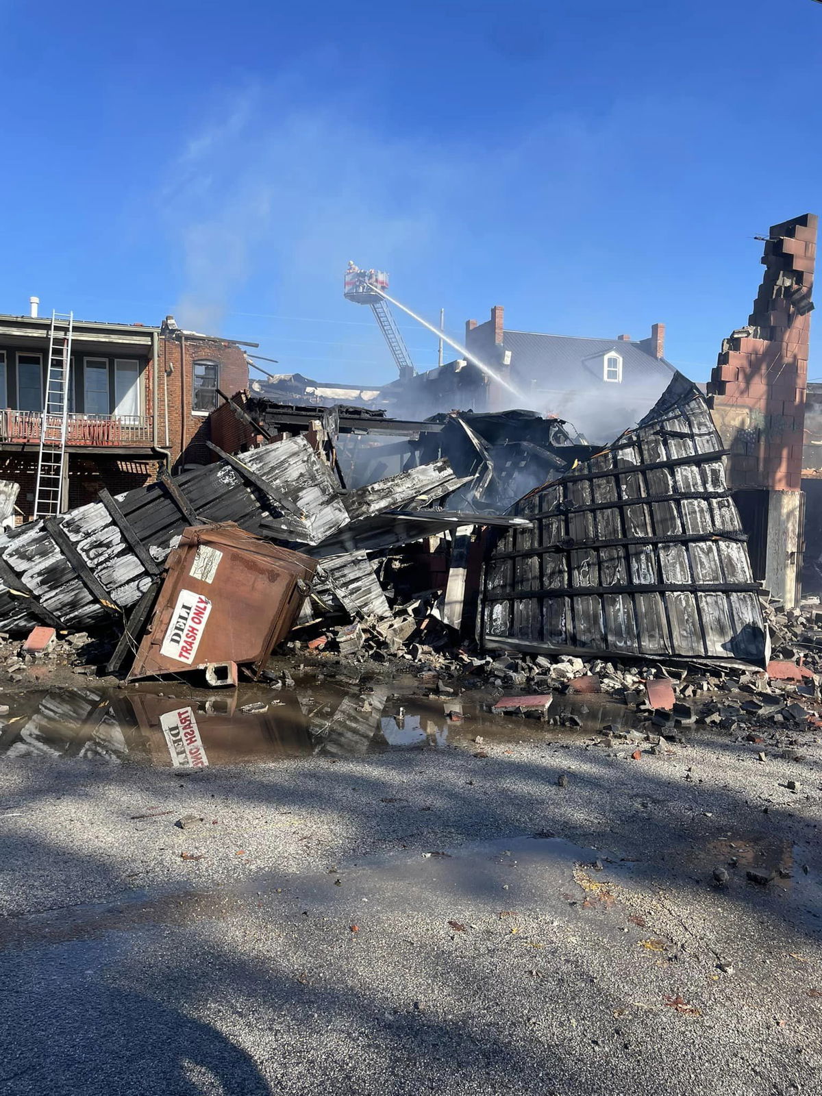 Firefighters work at a building on First Street in Hermann on Monday, Nov. 11, 2024.