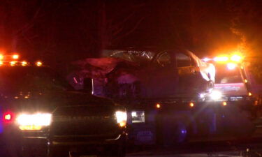 Burnt car being towed following vehicle fire on E Englewood Rd Nov. 23, 2024