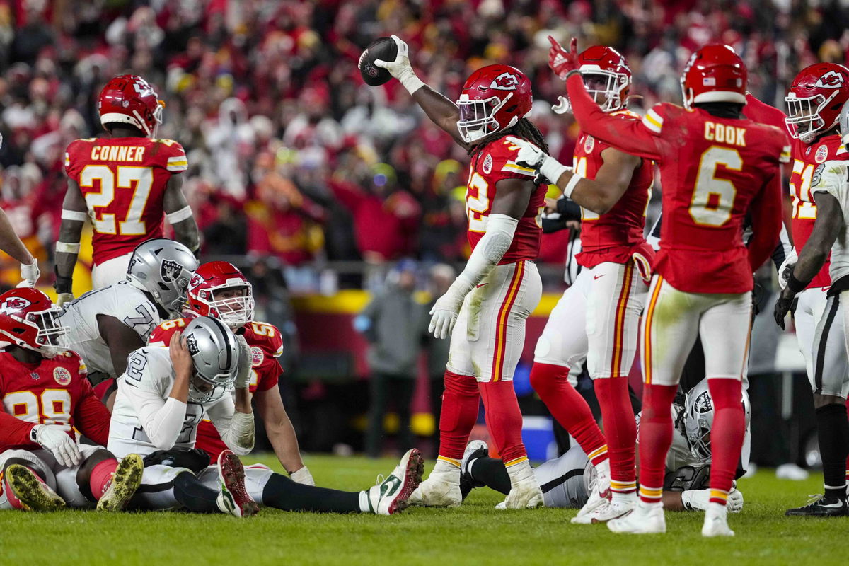 Kansas City Chiefs linebacker Nick Bolton (32) holds the recovery ball after a fumble by the Las Vegas Raiders during the second half of an NFL football game in Kansas City, Mo., Friday, Nov. 29, 2024. 