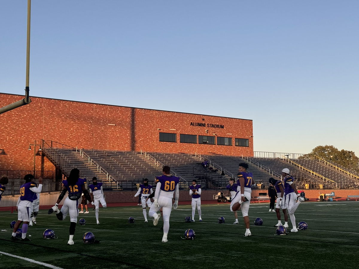 Hickman High School football players warm up before a district game against Francis Howell Central on Friday, Nov. 1, 2024.