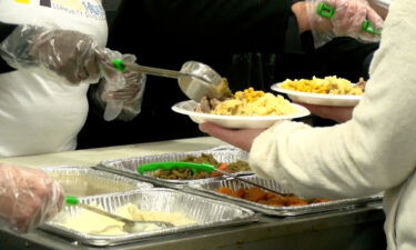 Volunteers serving food at the Powerhouse Community Development Thanksgiving event