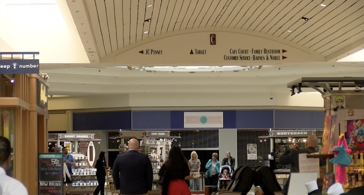 Shoppers walk through the Columbia Mall.